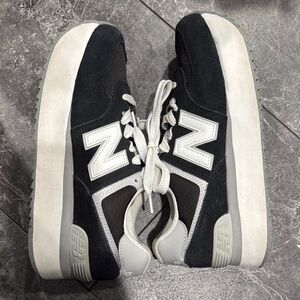 New Balance women’s Black and White 574 platform Sneakers